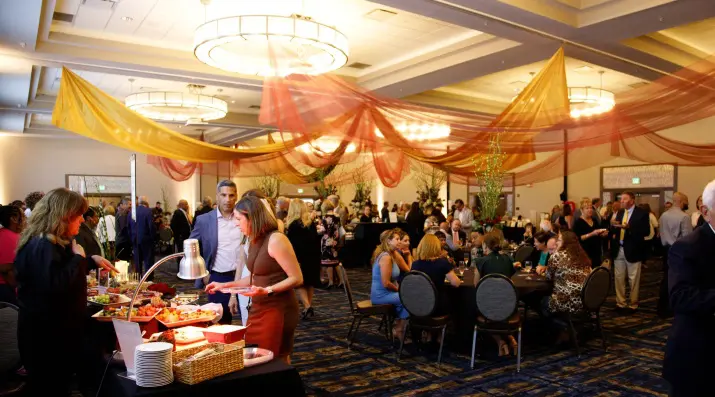 A ballroom decorated for the Taste of Friendship gala.