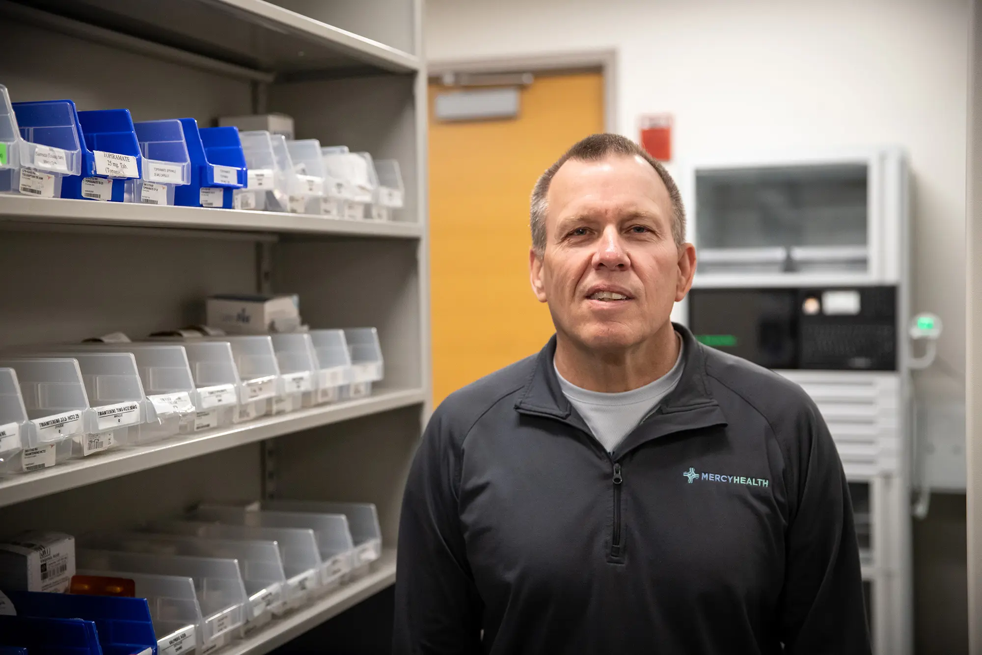 Man standing inside a pharmacy