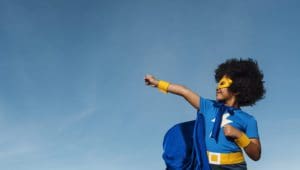 child in superhero costume