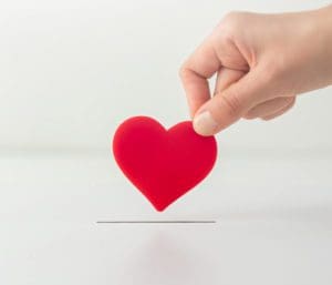 hand holding paper heart