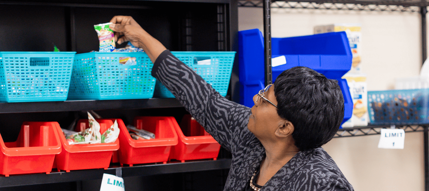 An older woman shops from the pantry at the Cradock Community Health Hub.