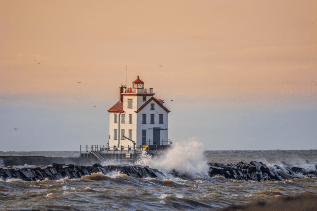 The Lorain Harbor Lighthouse is a white house with a red roof in Lorain, OH.