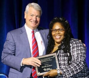 Fred Gilmer presenting Brenda Jackson with a Compassionate Care Award.