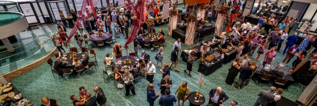 An overhead view of a crowded dining room floor during an event.