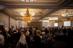 Guests sitting at tables in an event space