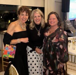 Laura Proto, Jamie Mazza, and Erin Spangler photographed at the Heart of Gold Memorial Gala
