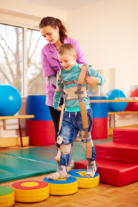 A child undergoing physical musculoskeletal therapy in a rehabilitation center