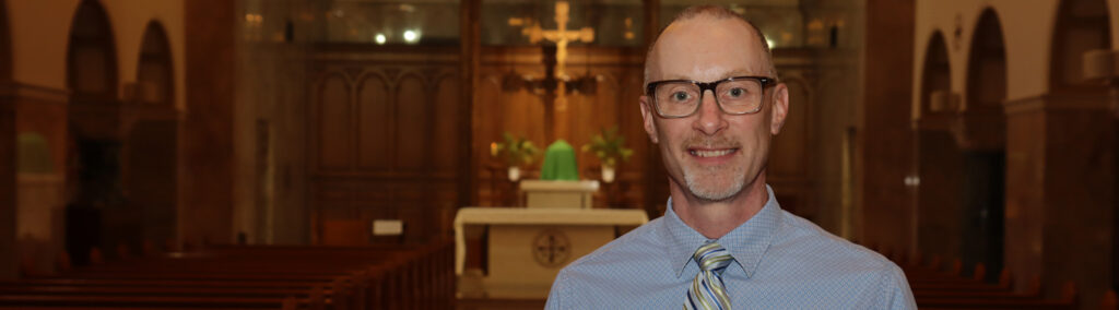 A man standing in a sanctuary
