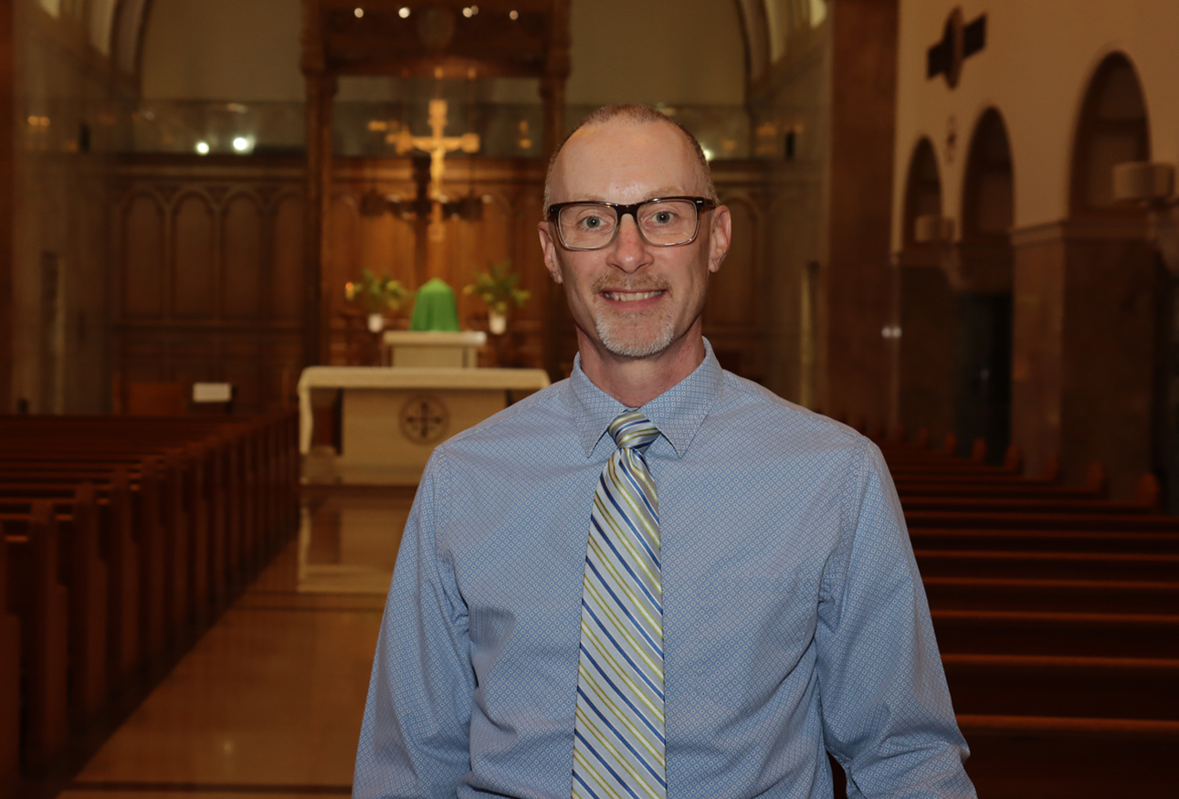 A man standing in a sanctuary