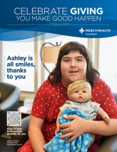 Cover of Mercy Health Foundation Celebrate Giving: smiling girl in a red dress holding a baby doll; headline reads 'Ashley is all smiles, thanks to you'