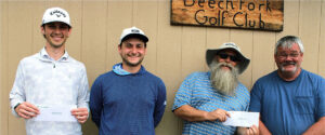 Four men pose outside Beechfork Golf Club, each holding a white envelope.