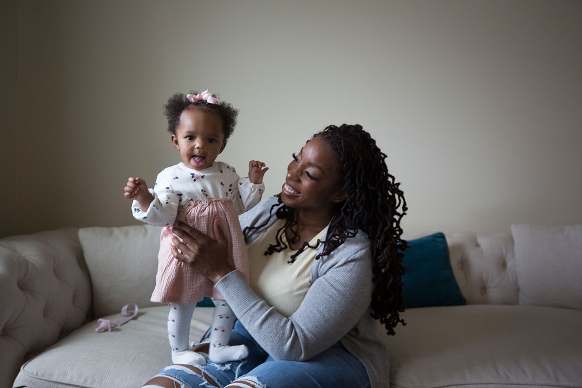 Kahdijah playing with her daughter