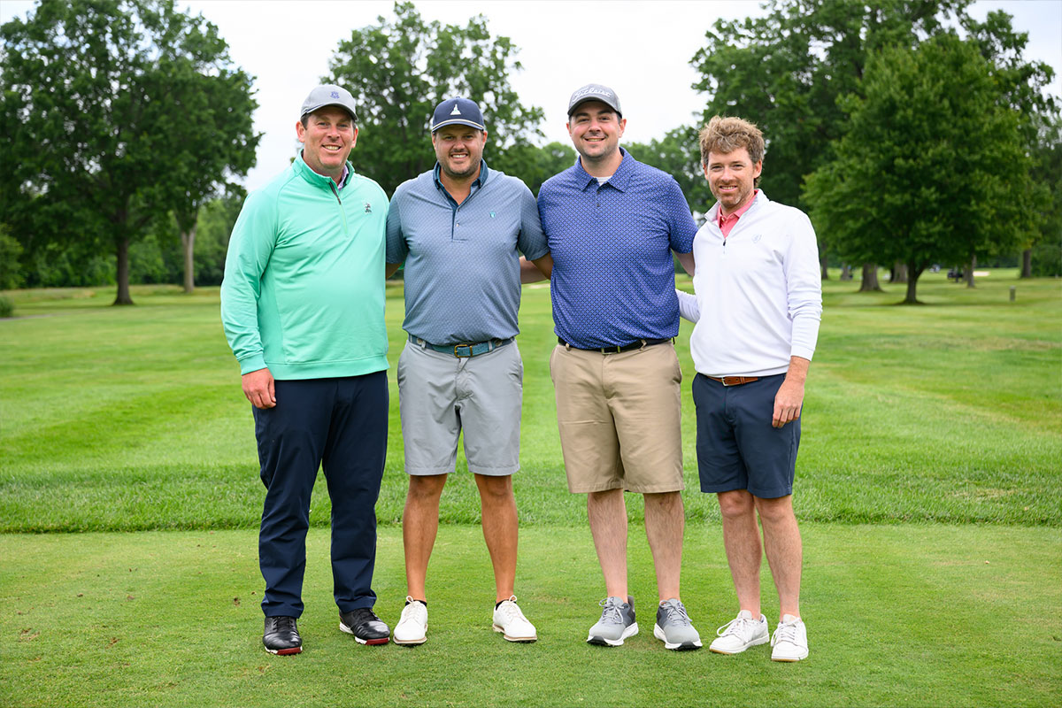Group of golfers on course at the lorain golf classic