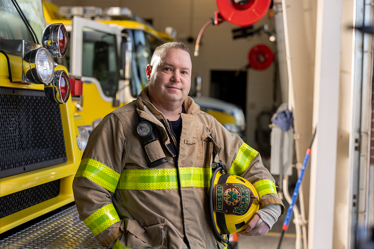 Steve Brown in front of firetruck
