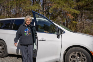 Kathy Banks outside of a van