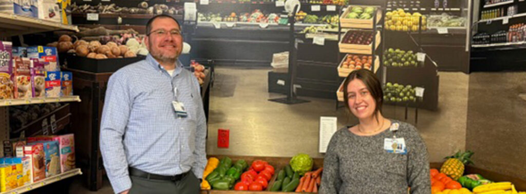 Chris and teammate in new rehabilitation grocery