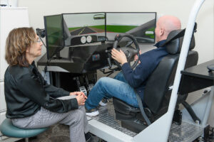 Justin Pfaff on the driving simulator