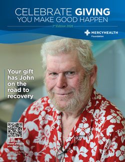 Mercy Health Foundation poster showing a smiling man in a red Hawaiian shirt, with the slogan 'Your gift has John on the road to recovery' and a QR code.