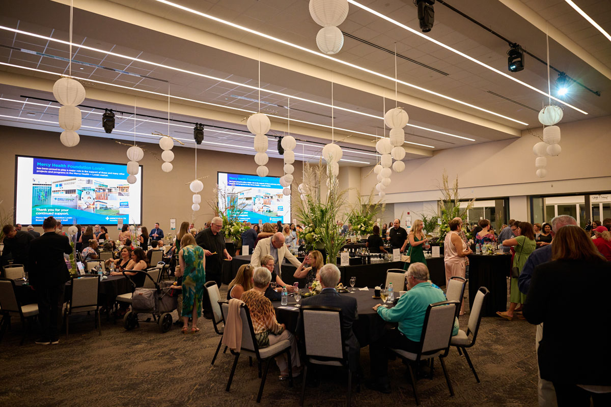 Event guests sitting at tables for Taste event