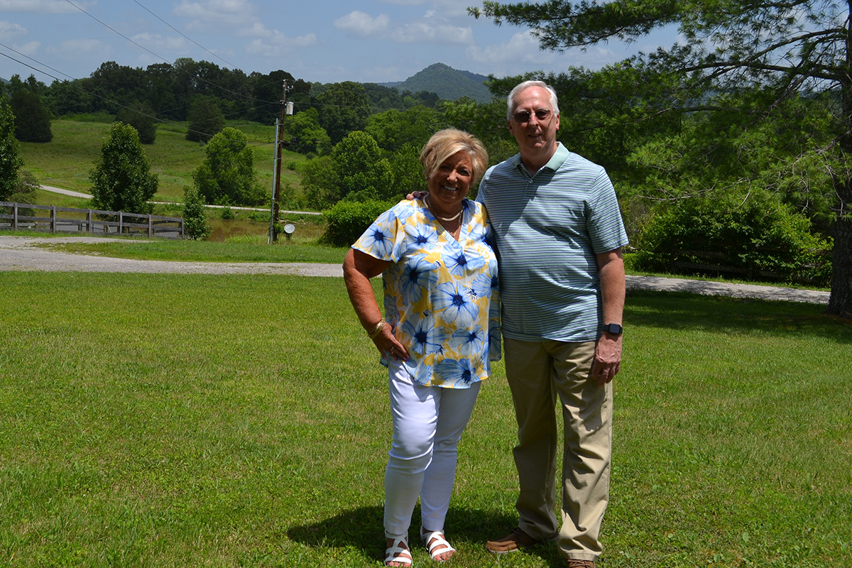 Sharon and her husband together outside