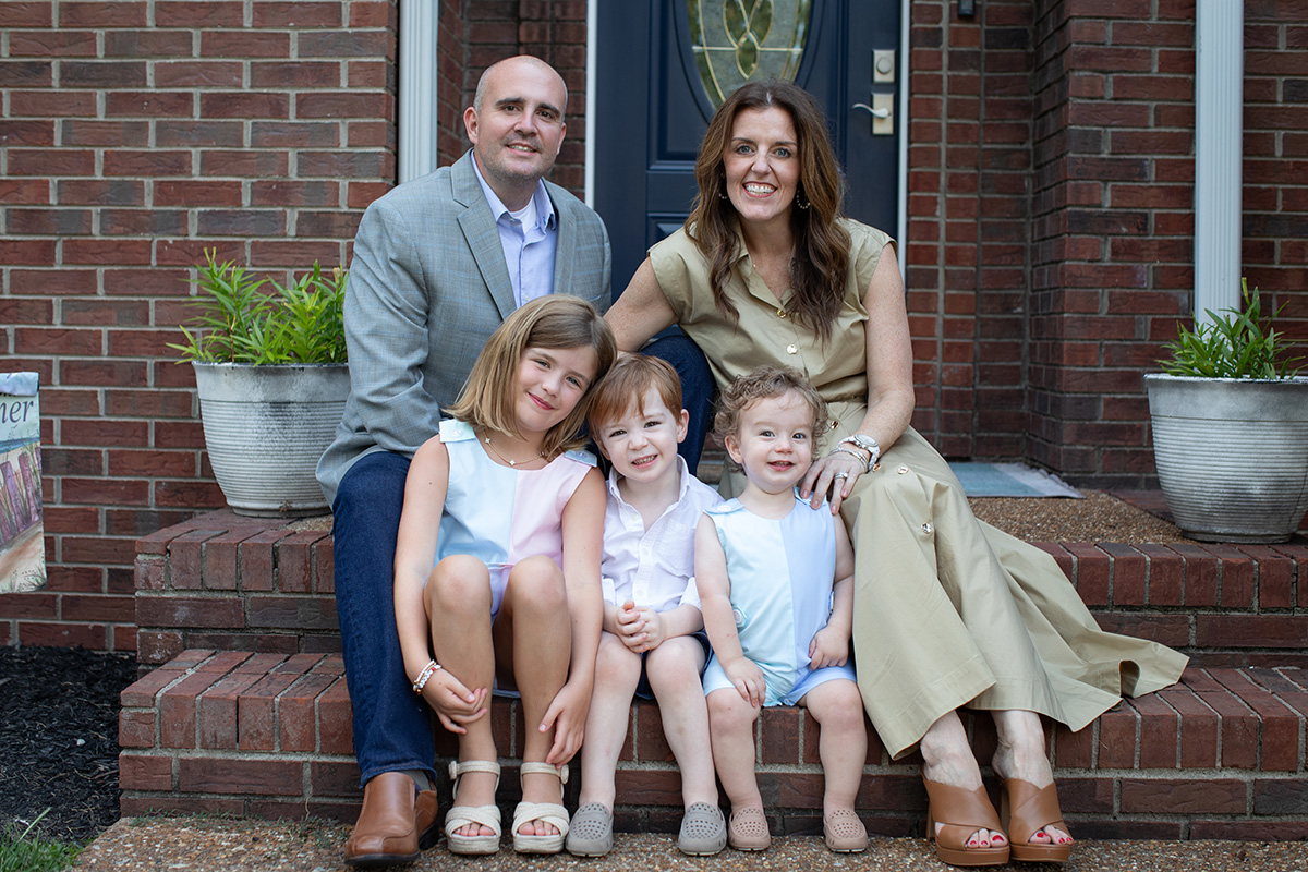 Dr Alice and her family on a doorstep