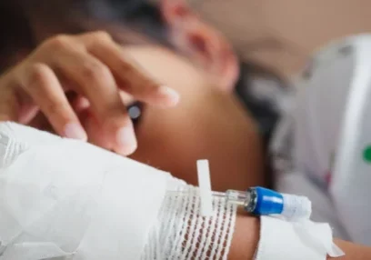 Sick kid feeling unwell lying down in an emergency room bed.