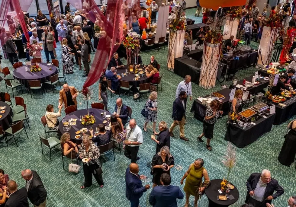 An overhead view of a crowded dining room floor during an event.